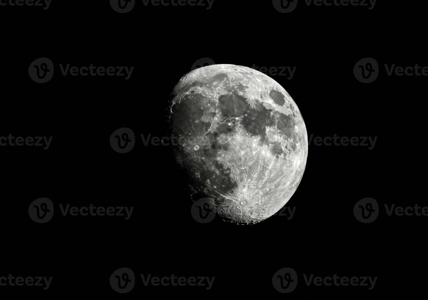 A striking image of the moon, illuminated against the vast darkness of the night. photo