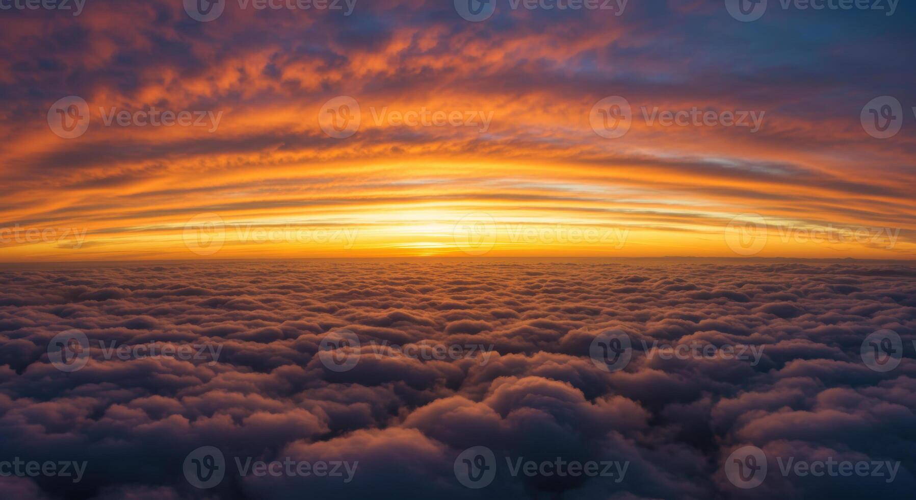A breathtaking panorama showcases a colorful sunset over a sea of clouds, a stunning sight. photo