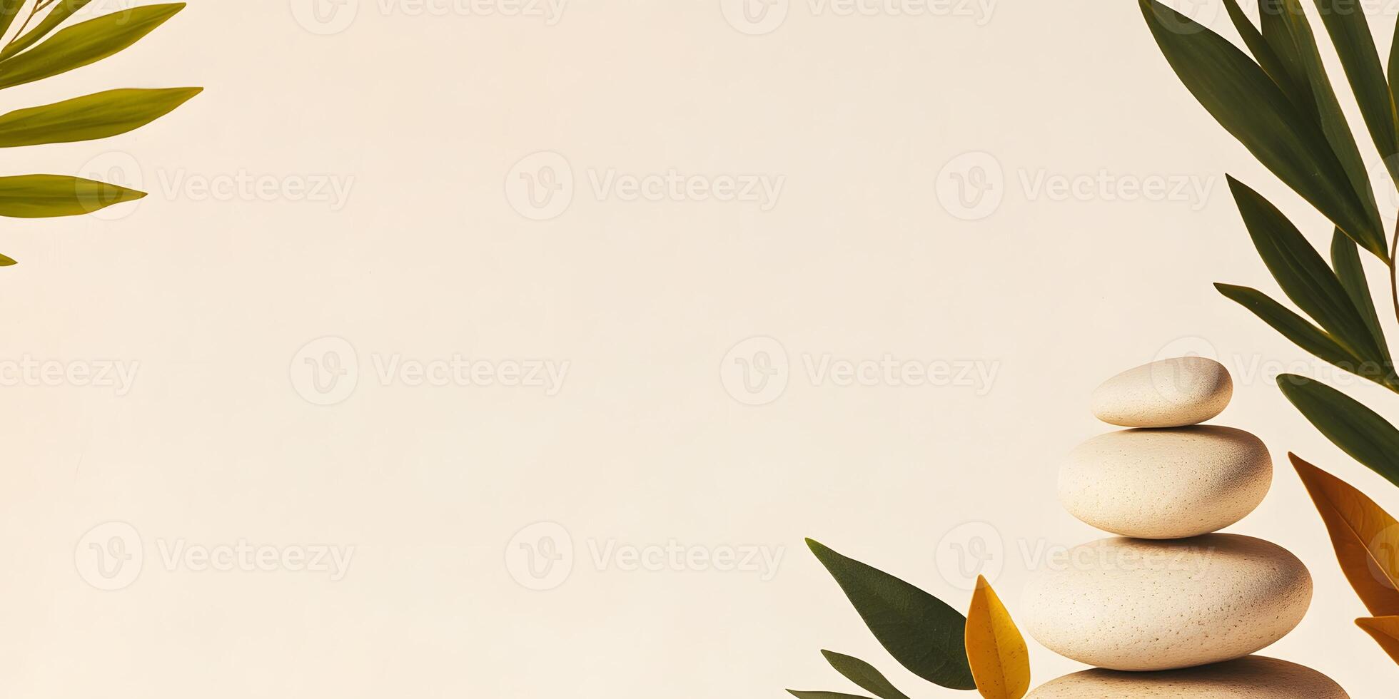 A Stack of Beige Stones with Green Leaves photo