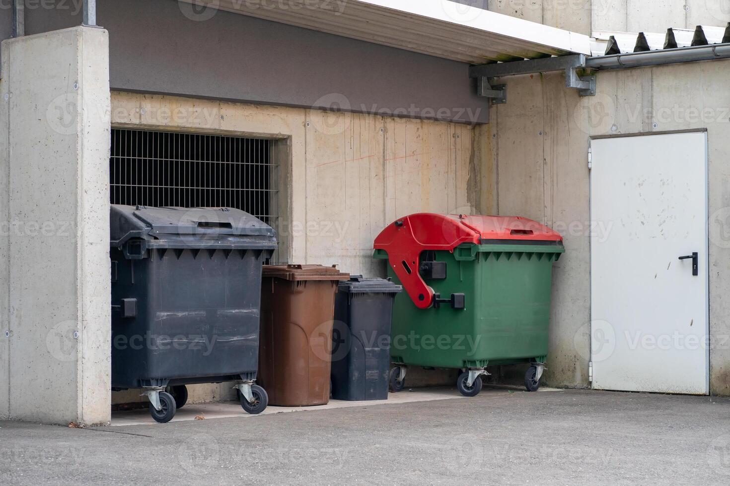 View of large and small plastic containers for various types of garbage photo