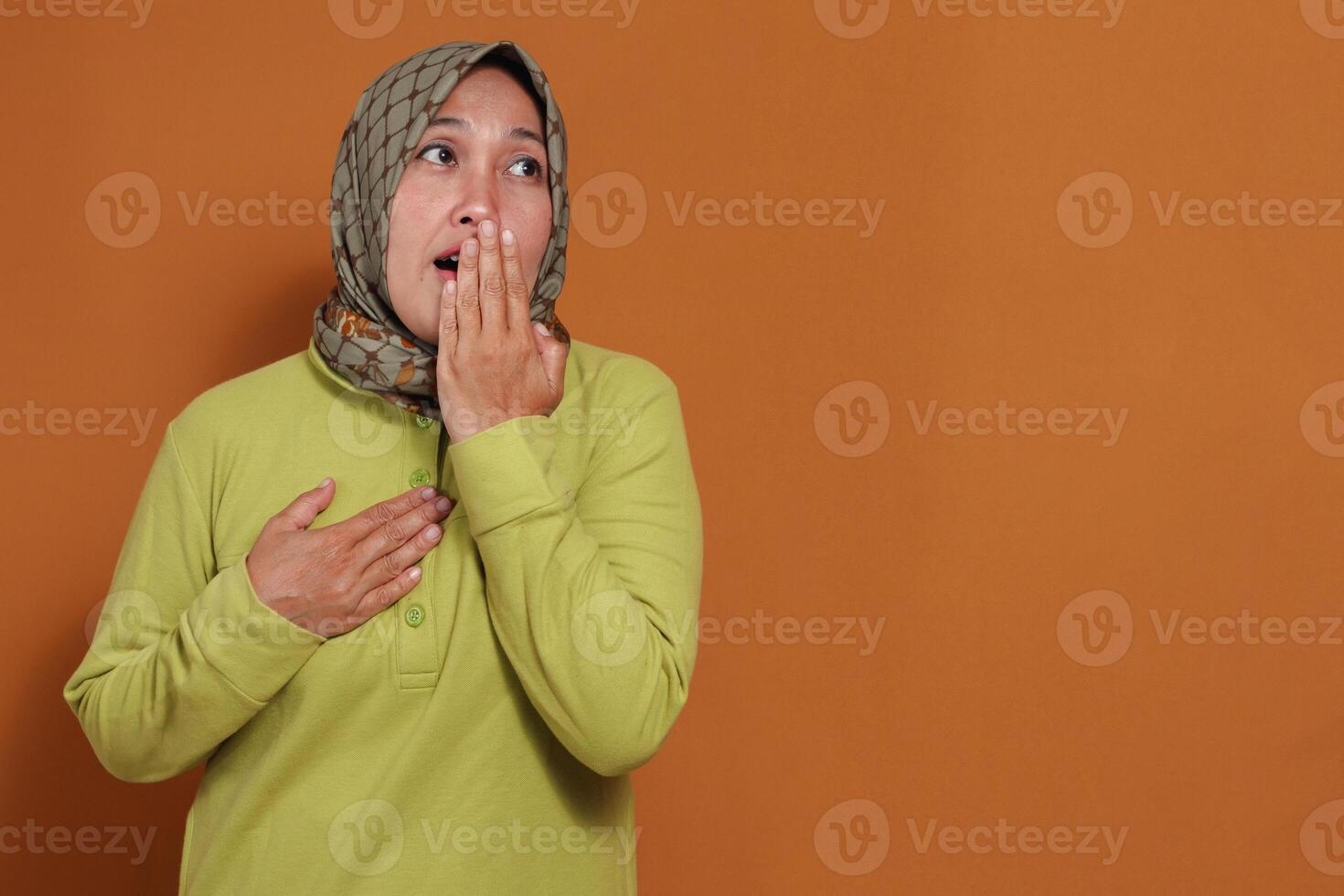 Surprised woman with emotional reaction and hand gesture, perfect for shock, expression, and human feeling-related concepts in advertising and storytelling photo