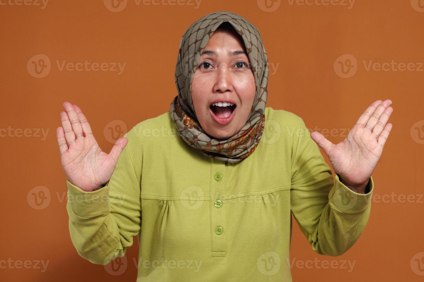 Surprised Muslim woman with hands raised, perfect for shock reaction ads, emotional expression, social media marketing, digital content, and storytelling photo
