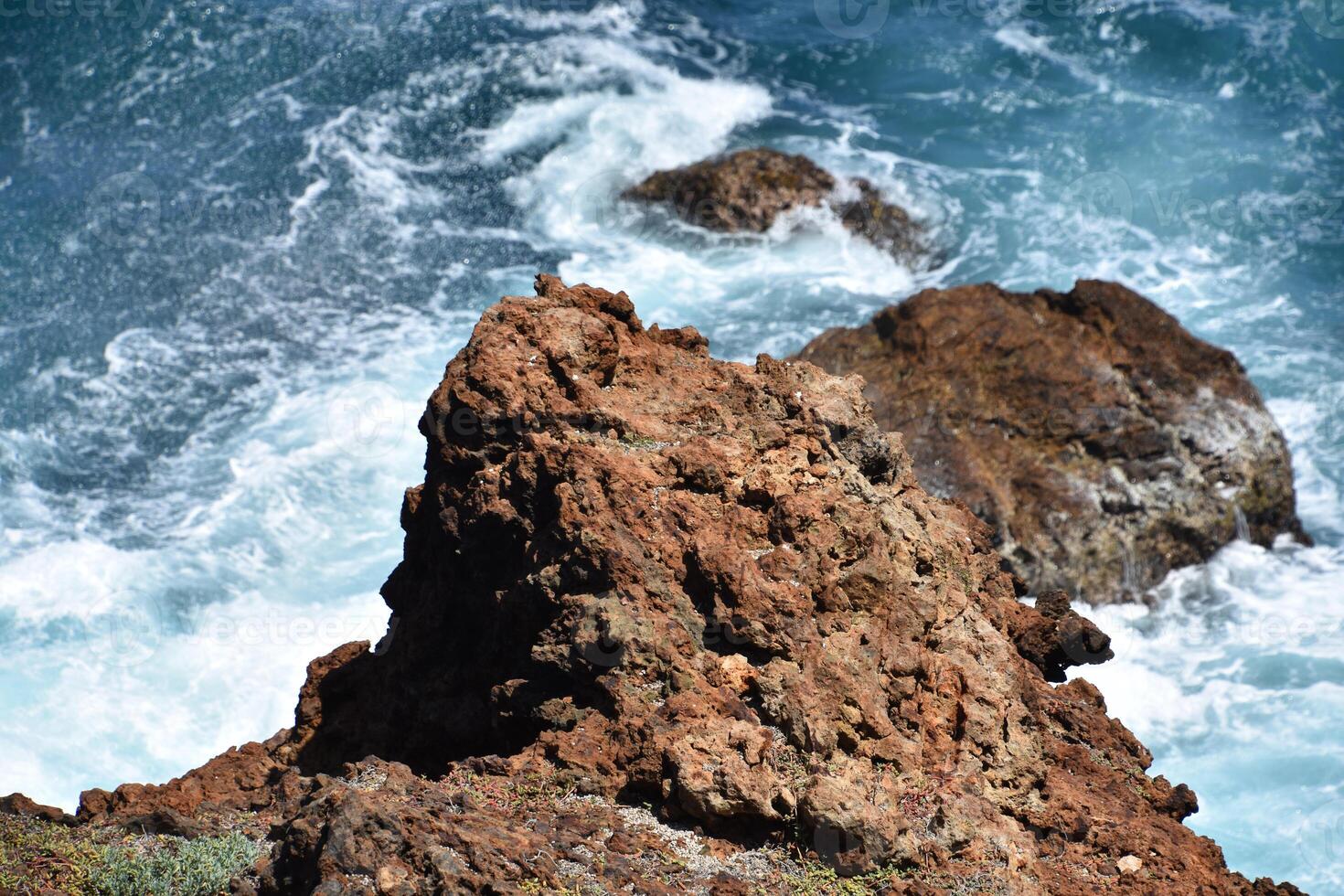 Lava Rock with Waves Splashing Along the Coast photo