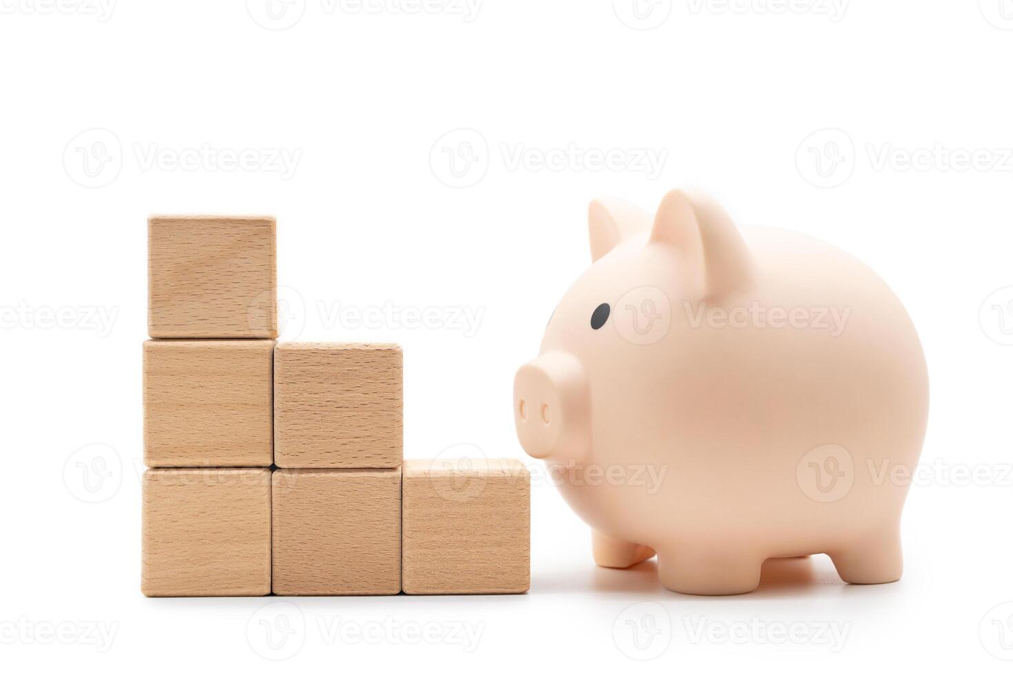 Blank wood cube or wooden blocks arrange in pyramid shape with Piggy Bank ,business concept. Isolated on white background photo
