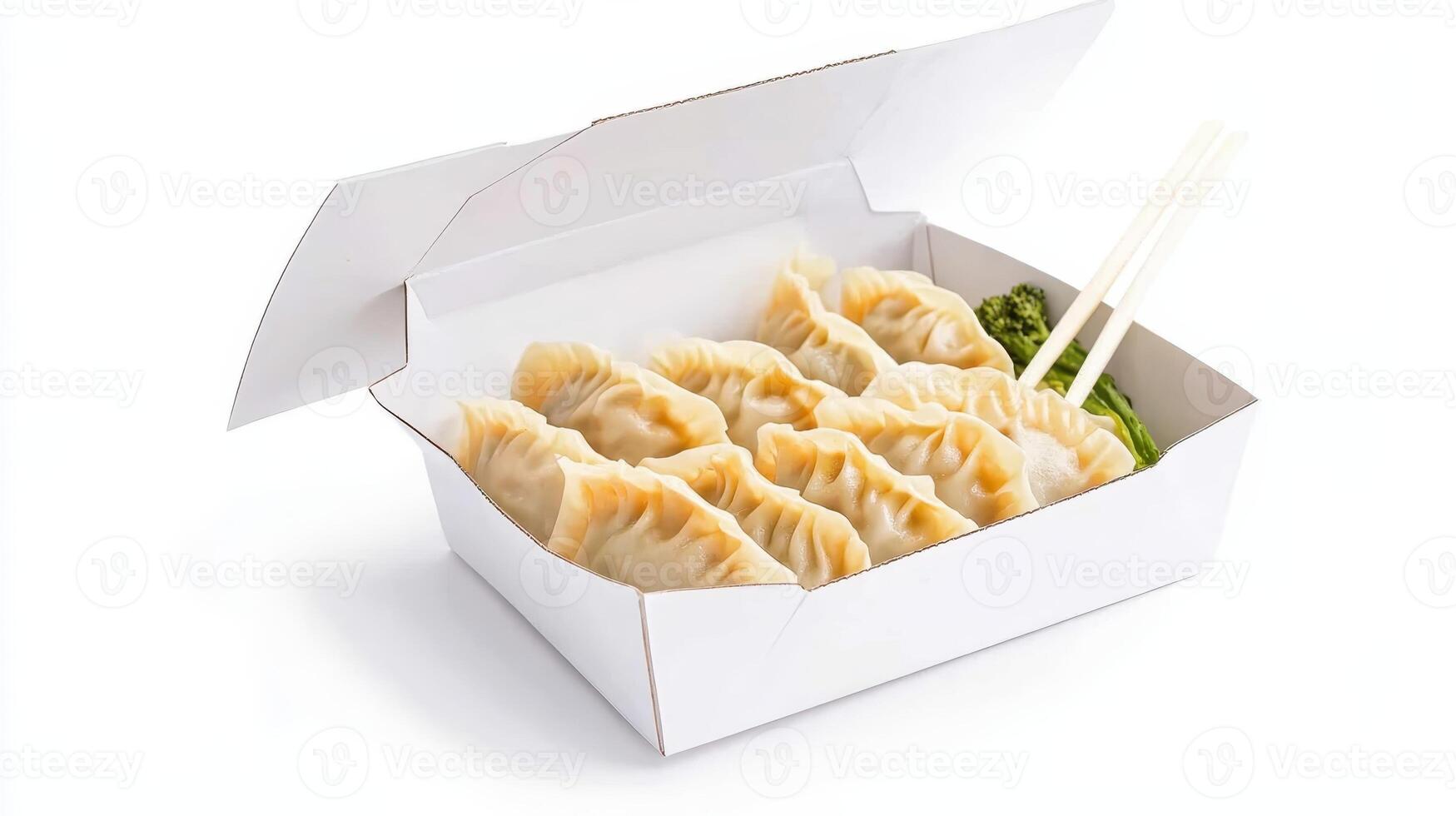 Delicious dumplings served in a takeout box with chopsticks ready for a satisfying meal at a local eatery photo