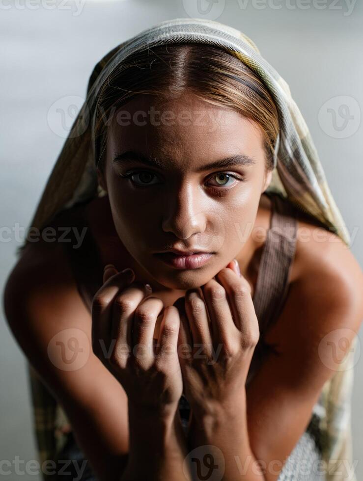 Expression of contemplation captured in a moment of quiet reflection in an urban setting photo