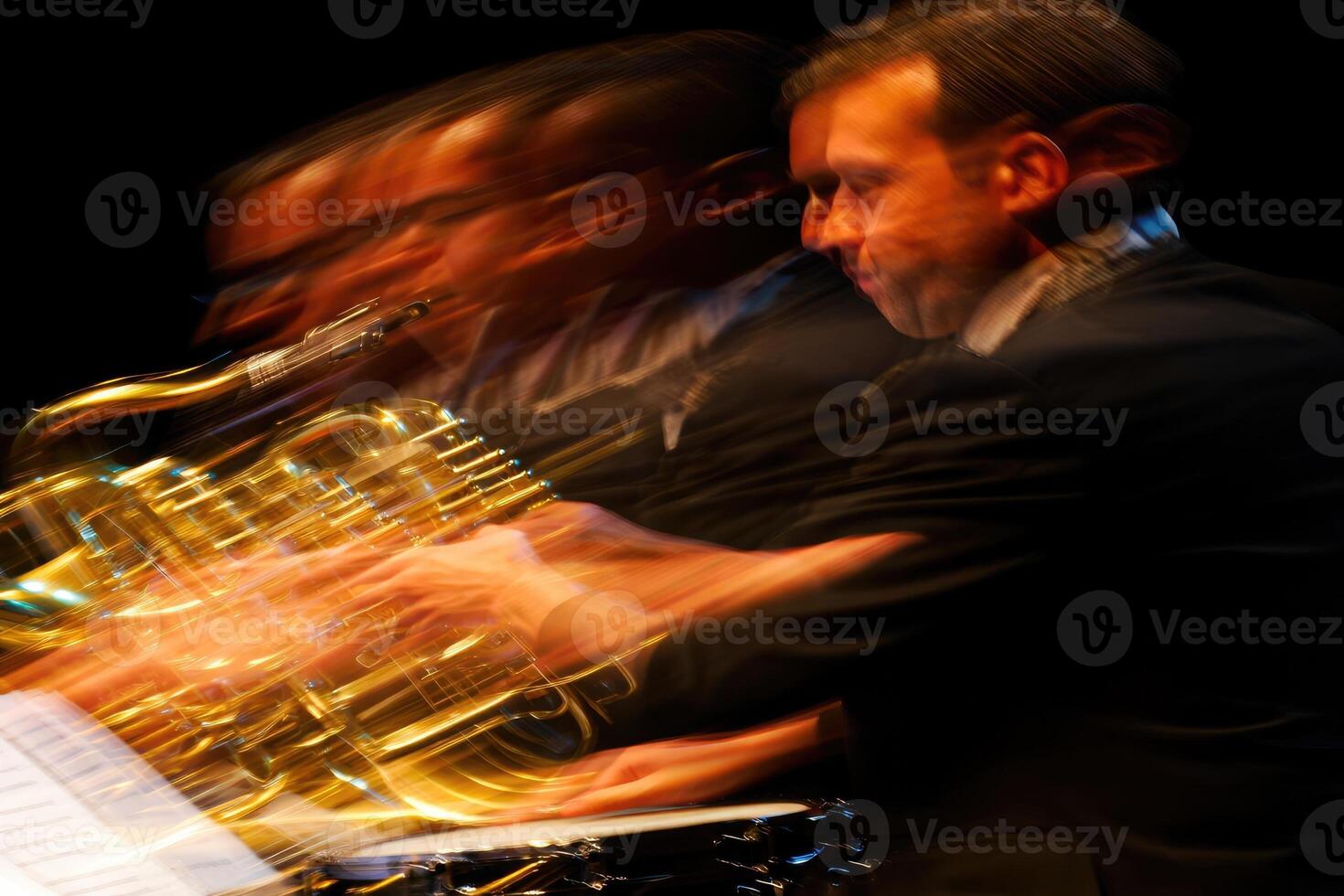 Musician performing with a horn in a dynamic jazz concert setting at night photo
