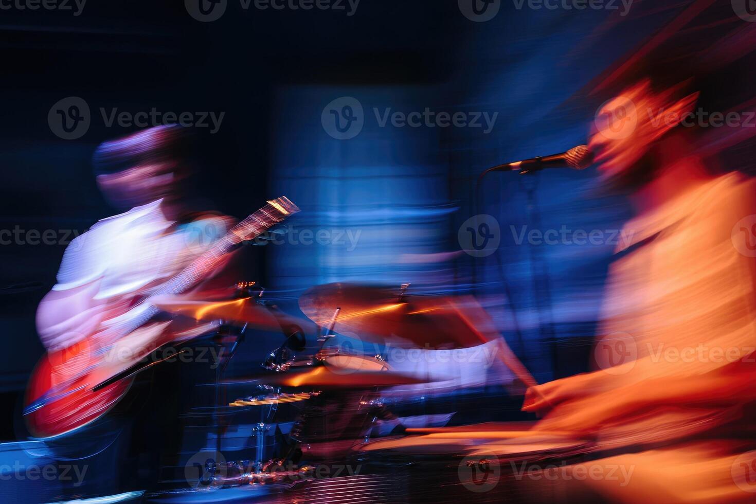 Live music performance with energetic musicians in a vibrant venue at night photo