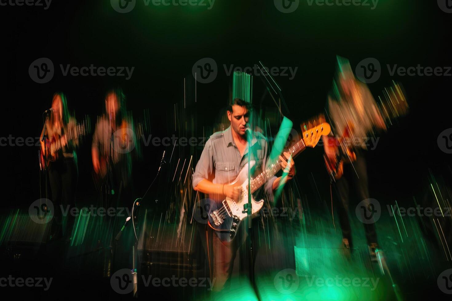 Band performs energetic live music on stage with dynamic lighting effects photo