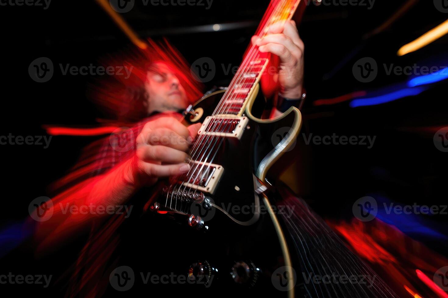 Guitarist performs energetically during live music show at local venue in evening hours photo
