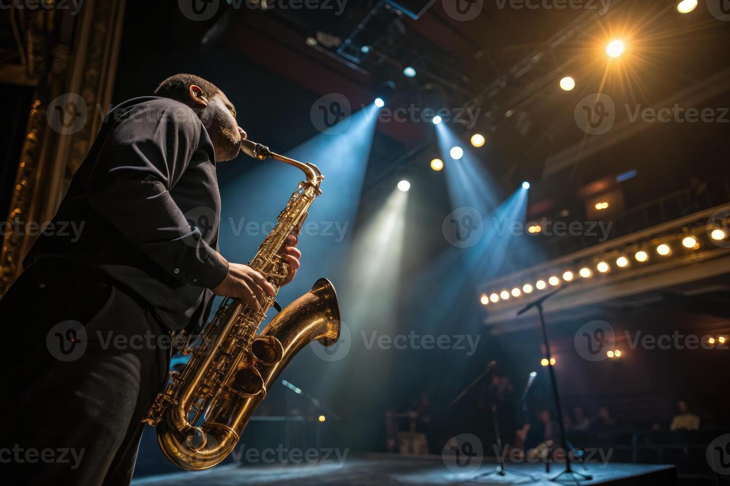 Musician performs on stage playing saxophone with dramatic lighting during concert photo