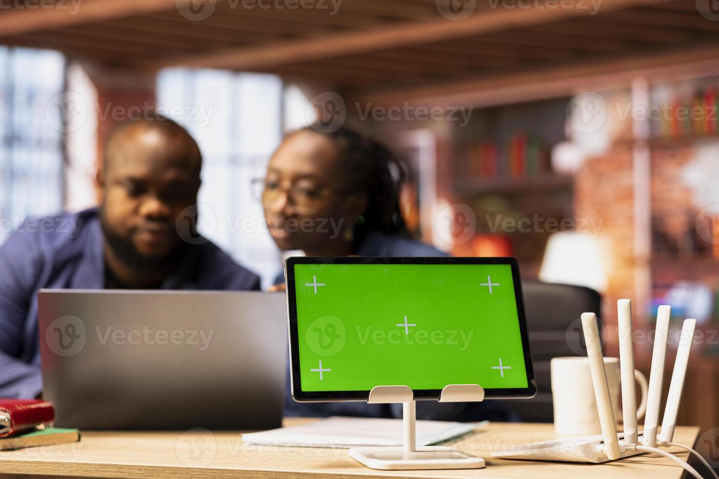 African American couple work as a team to fix their Wi-Fi setup next to copy space, troubleshooting router errors to maintain efficiency in their self employed careers. Weak internet connection. photo
