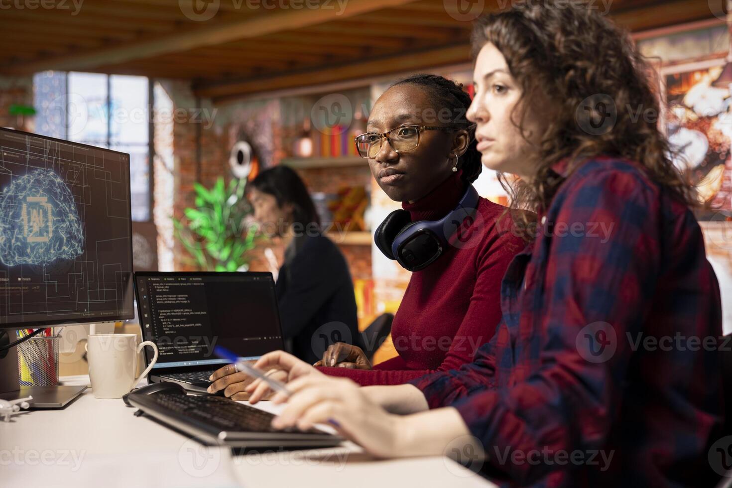 Team of programmers in artificial intelligence focused startup overseeing worker designing, coding and debugging applications. Teamworking colleagues doing code testing and quality assurance photo