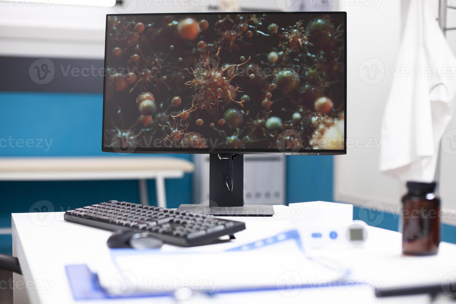 Closeup on computer screen displaying cellular structures related to flu disease, highlighting technology used for biological research. Modern desktop pc clinic office desk shows image of viral cells. photo