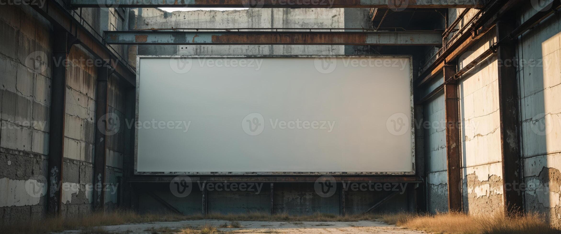 An empty warehouse with a large screen in the middle photo