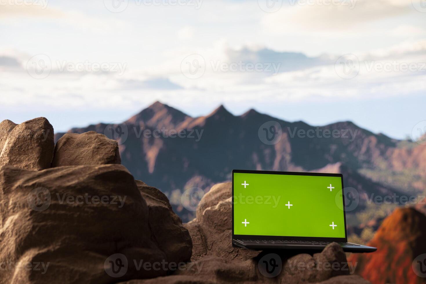 Breathtaking mountain range view across the horizon with a chroma key, offering a spectacular scenic landscape for hikers and adventurers. The rugged terrain is a challenge worth conquering. photo