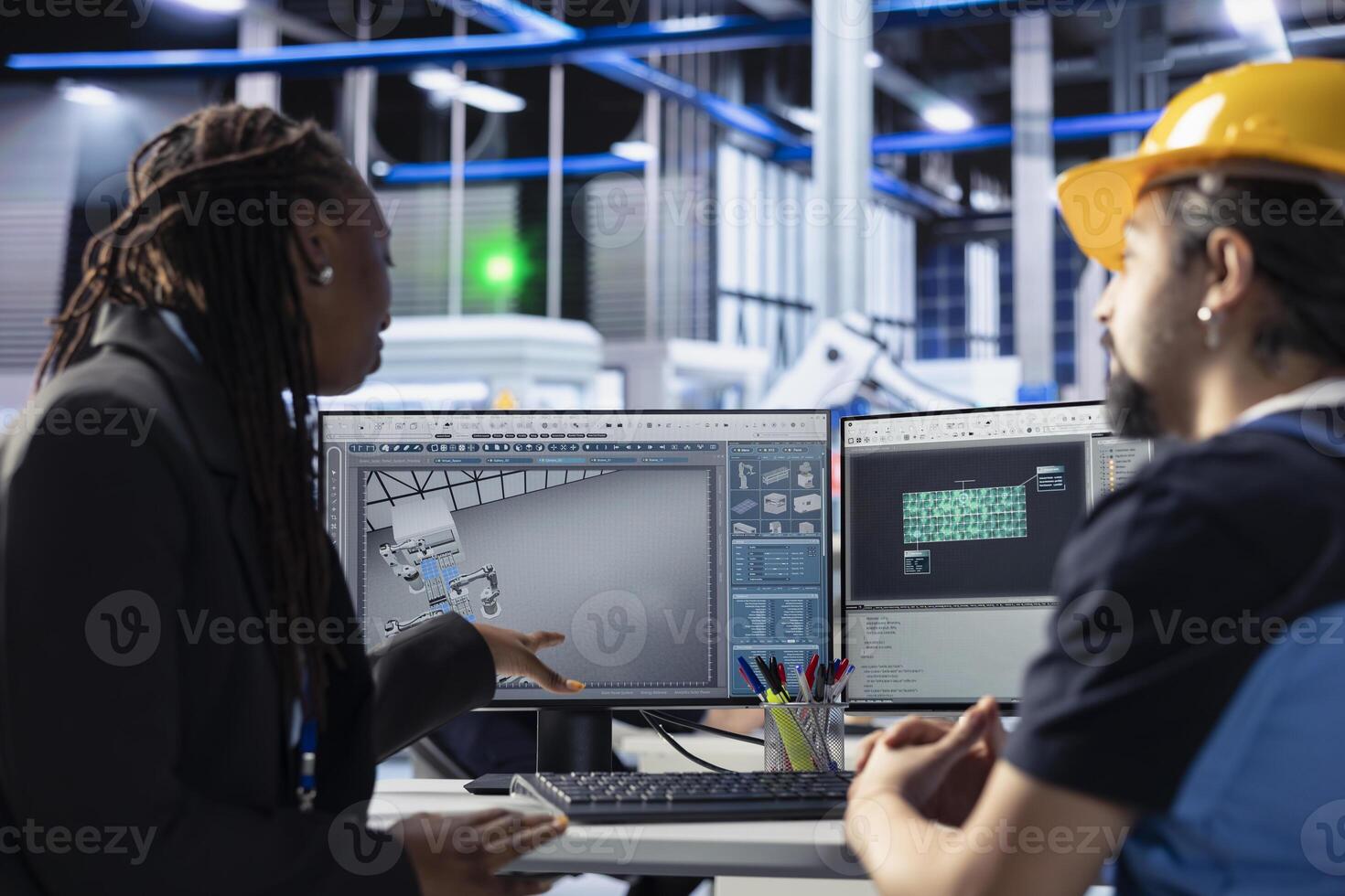 Teamworking photovoltaics factory colleagues using tablet to do finetuning of system settings for maximum efficiency. Engineering team looking at solar panel assembly lines configuration on PC photo