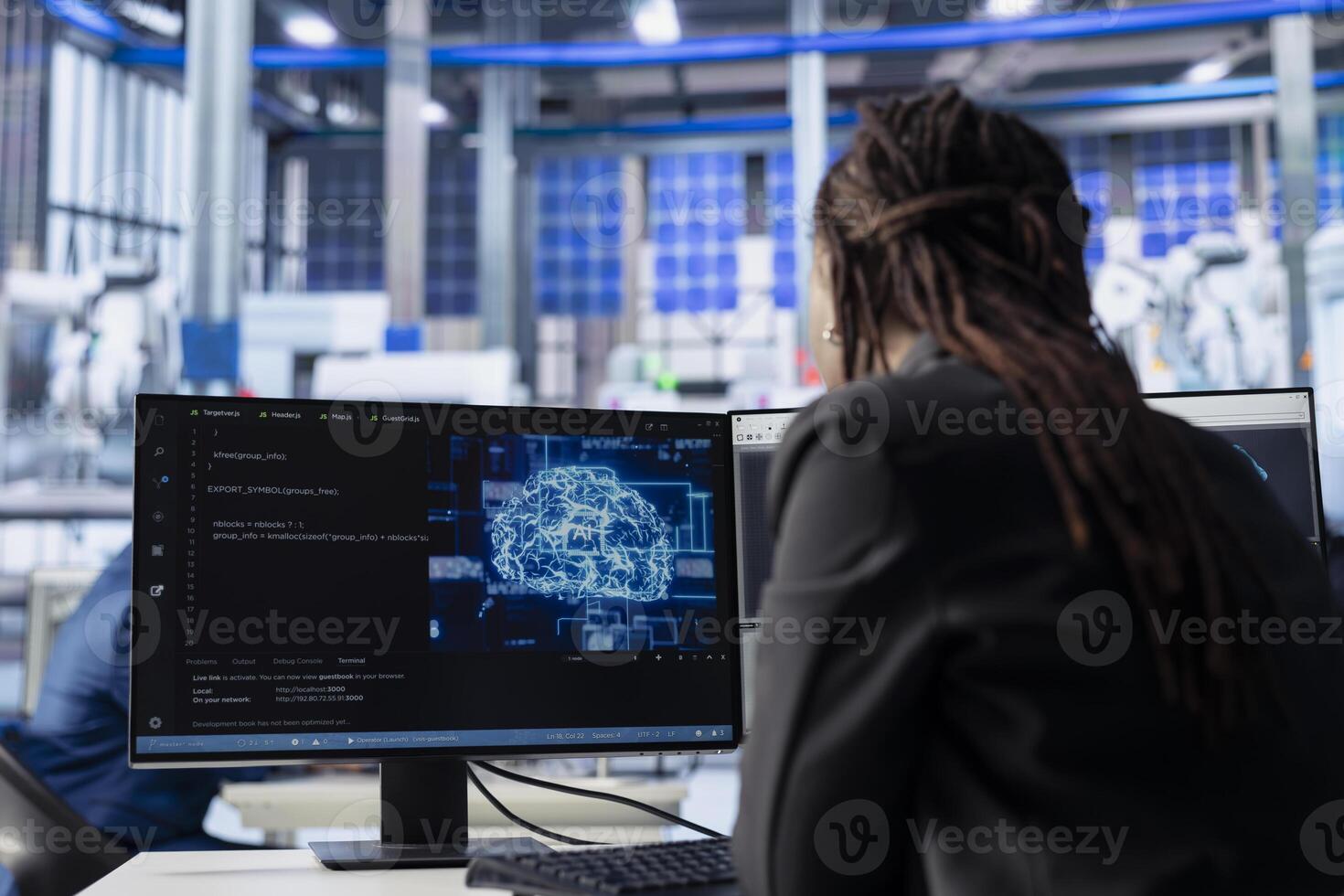 Engineer developing AI algorithms on PC in solar panel plant, training models to predict equipment failures. Technician integrating machine learning solutions to enhance production efficiency photo