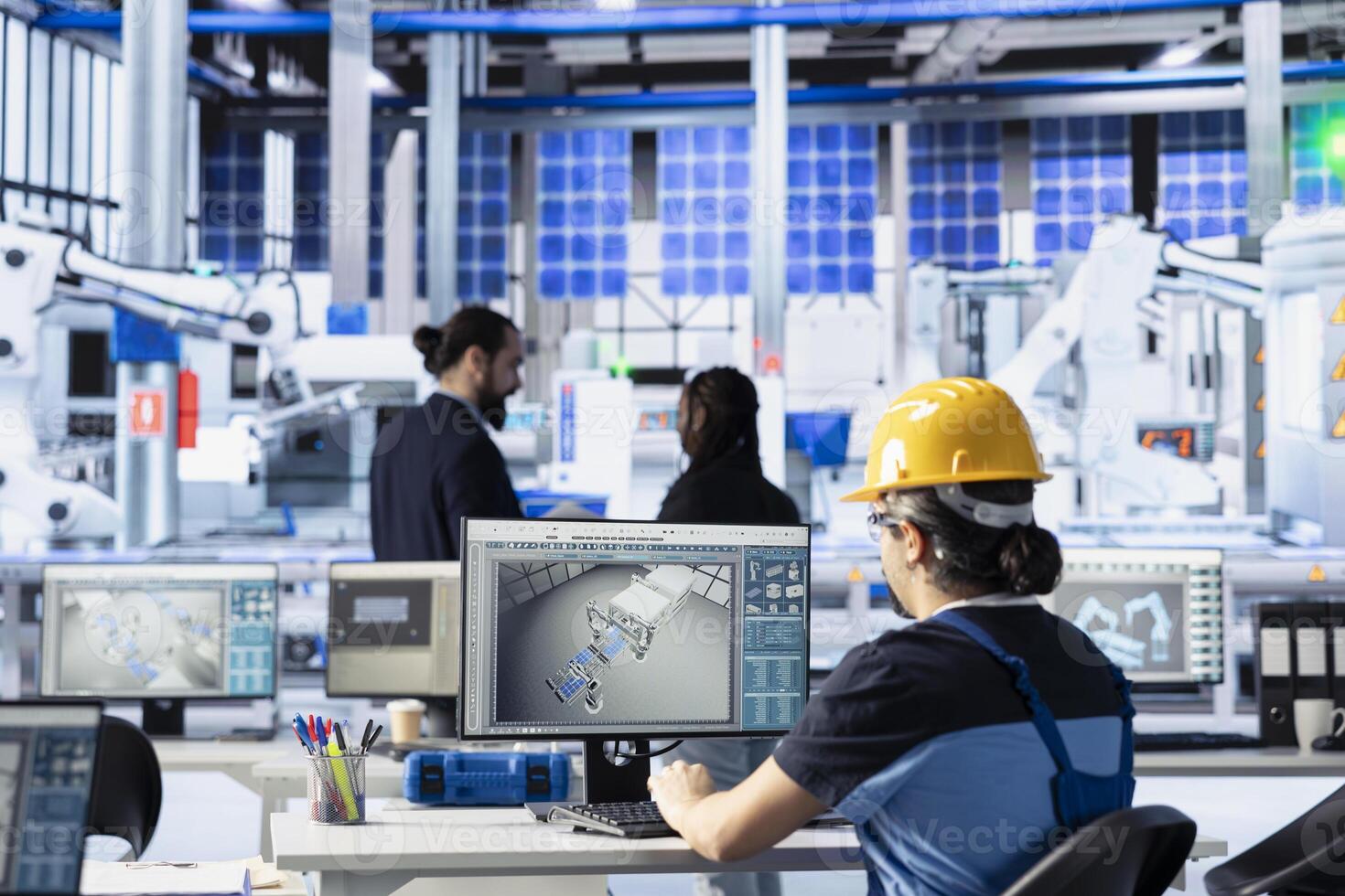 Engineer in solar technology factory reviewing system logs on computer to identify operational inefficiencies. Photovoltaic plant employee monitoring data on PC, adjusting manufacturing parameters photo