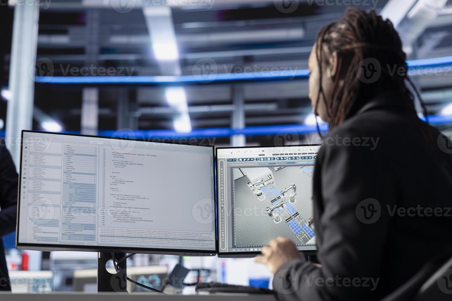 Photovoltaics factory software developer coding program monitoring system performance. African american woman in solar panels plant writing code, tracking energy production and efficiency photo