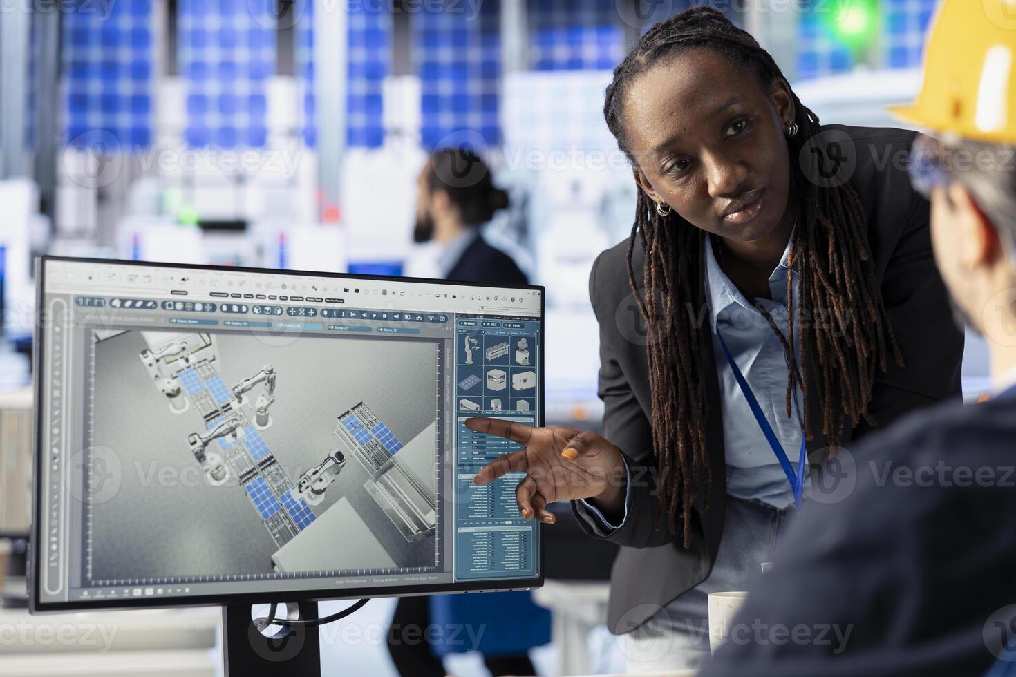 Solar panels plant teamworking colleagues looking over factory energy consumption on computer. Photovoltaics facility coworkers doing brainstorming, managing manufacturing resources using PC photo