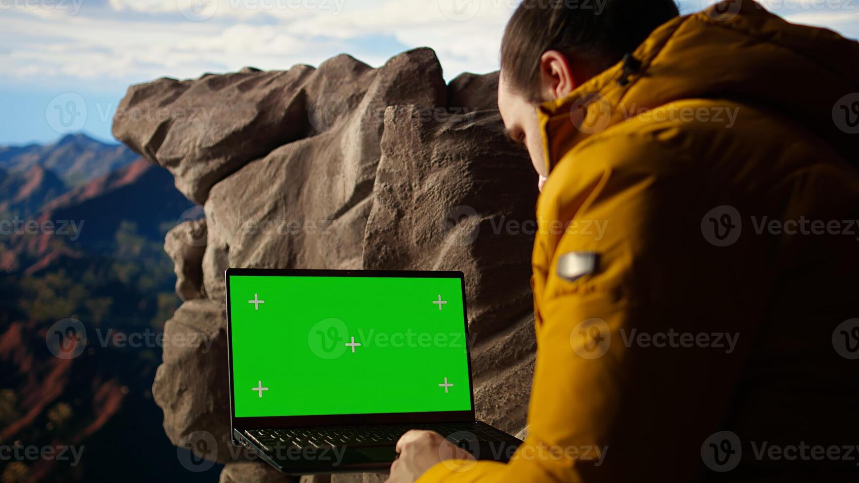 Trekker takes in the panoramic landscape next to isolated mockup screen, where the peaceful mountain scenery and open sky symbolize adventure and perseverance. Wanderlust. Camera A. photo