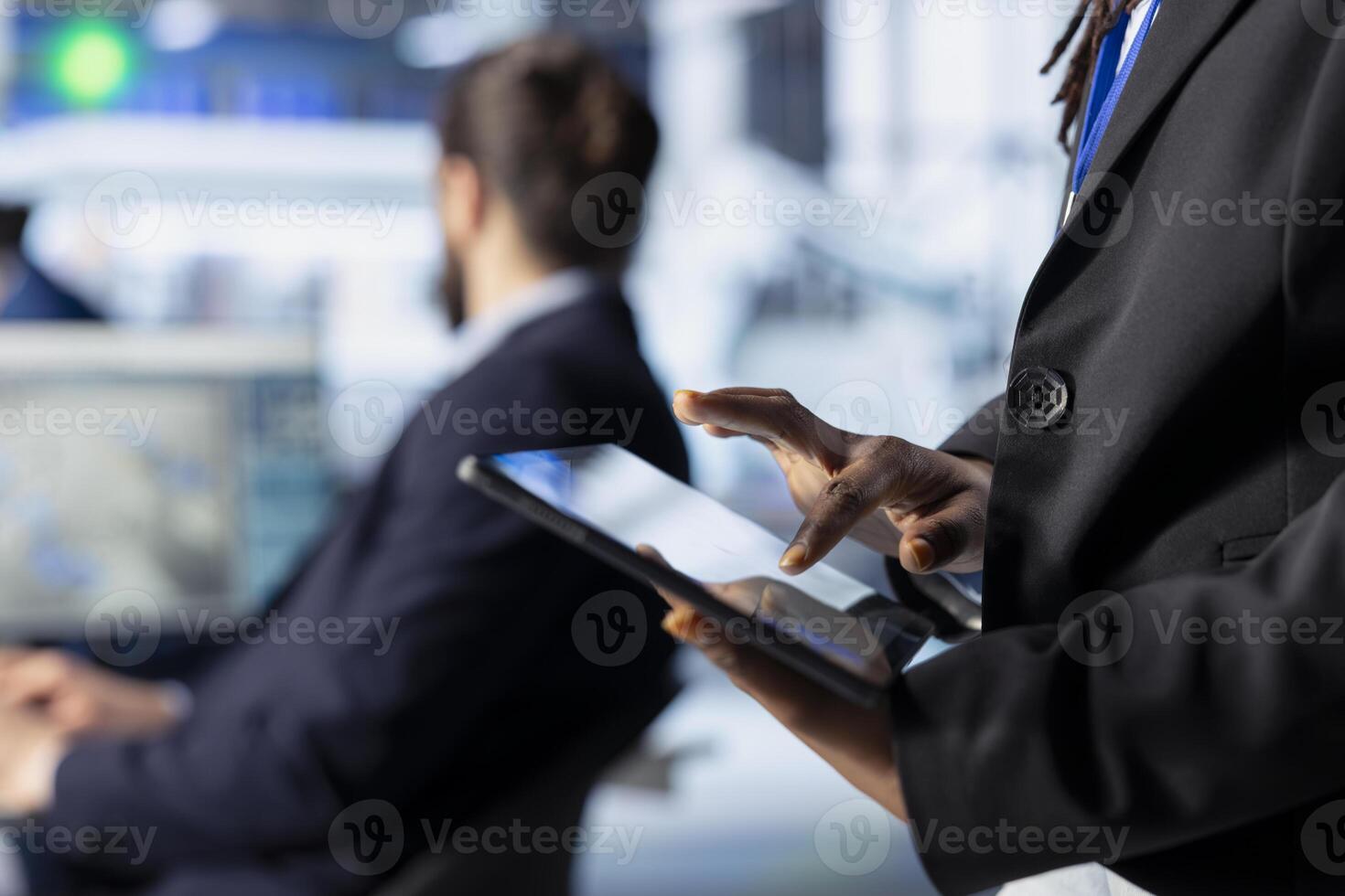 Engineer in solar panel plant adjusting robotic machinery settings using tablet app. Close up of employee walking with device in photovoltaics factory, diagnosing equipment performance issues photo