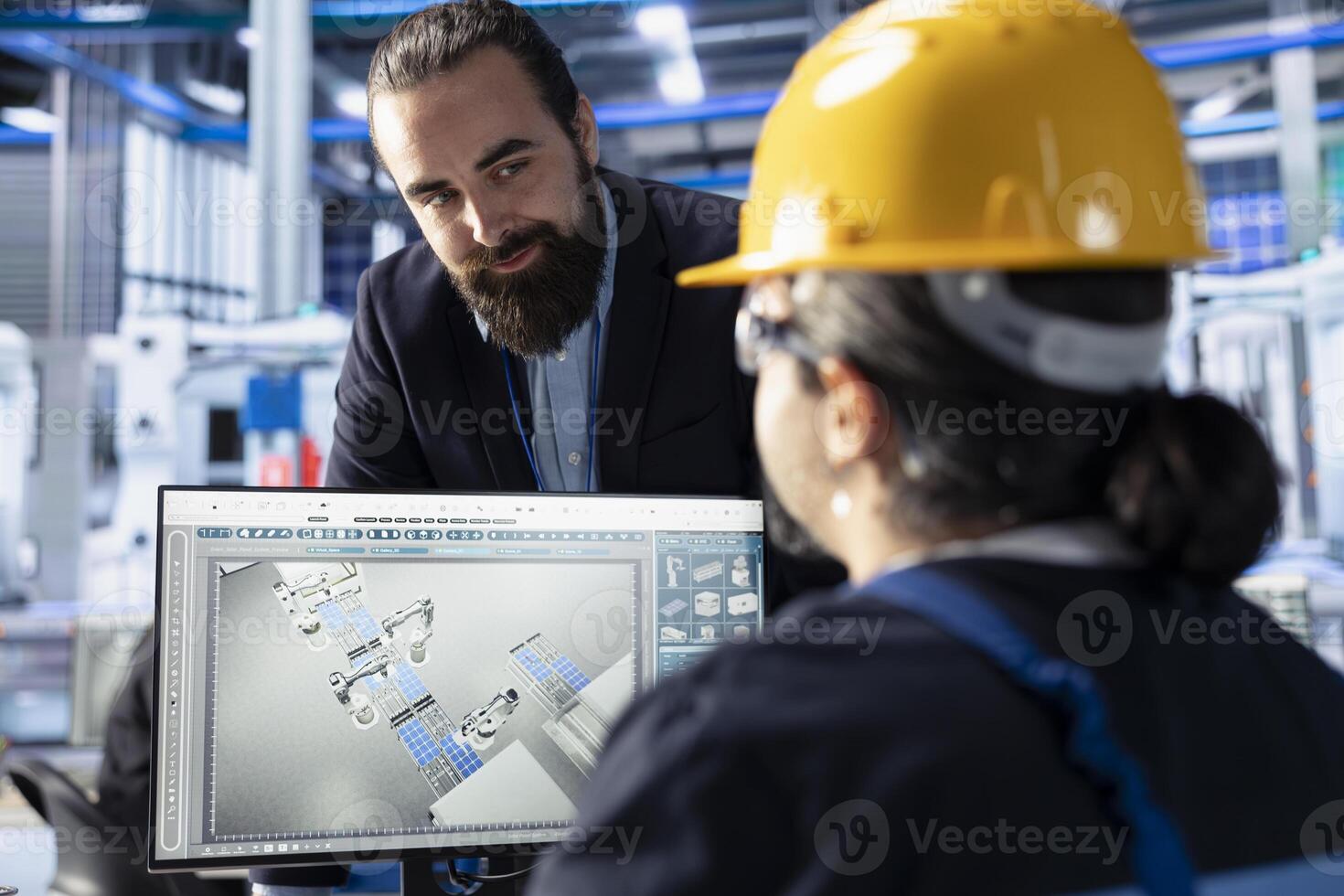 Photovoltaics factory engineering team optimizing production flow. Sustainable energy solar panels plant teamworking colleagues monitoring manufacturing process on computer photo
