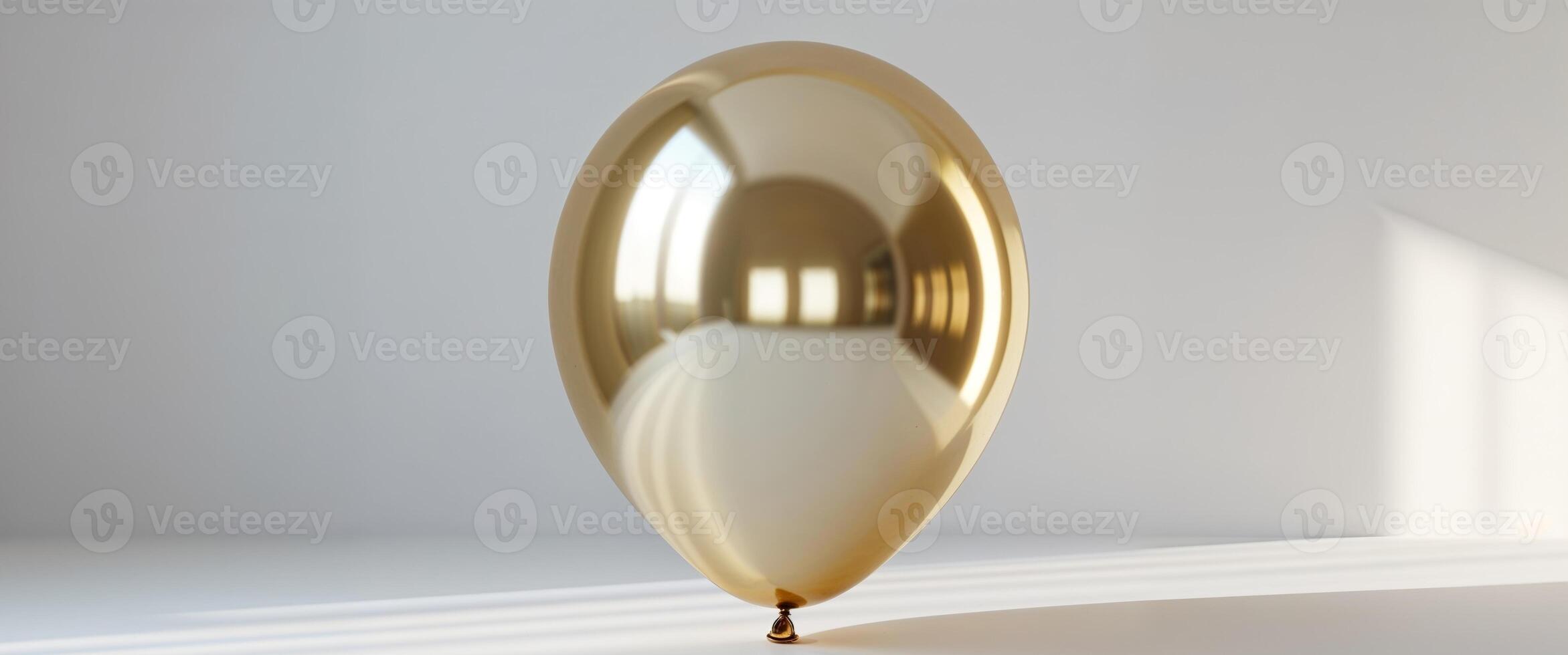 A golden balloon with a reflection on it photo