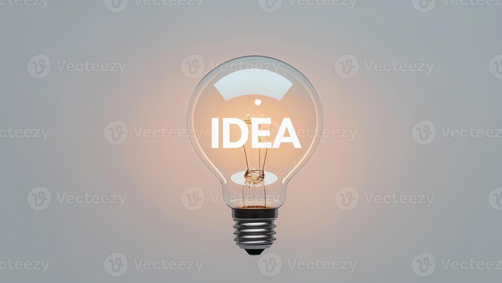 Glowing Light Bulb with Word IDEA Inside photo
