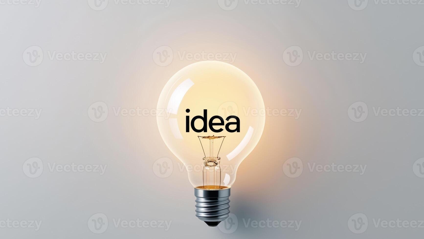 Glowing Light Bulb with Word IDEA Inside. photo