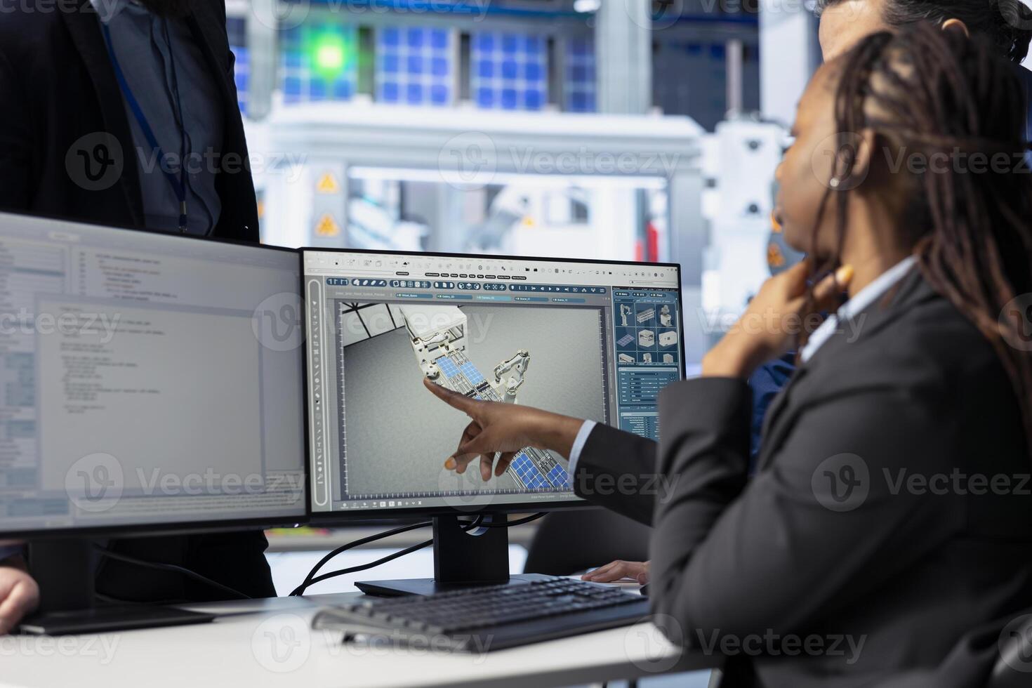 Photovoltaics factory programmer coding on PC to improve solar panels efficiency, presenting modifications to manager. Developer working in solar panels manufacturing plant, talking with supervisor photo