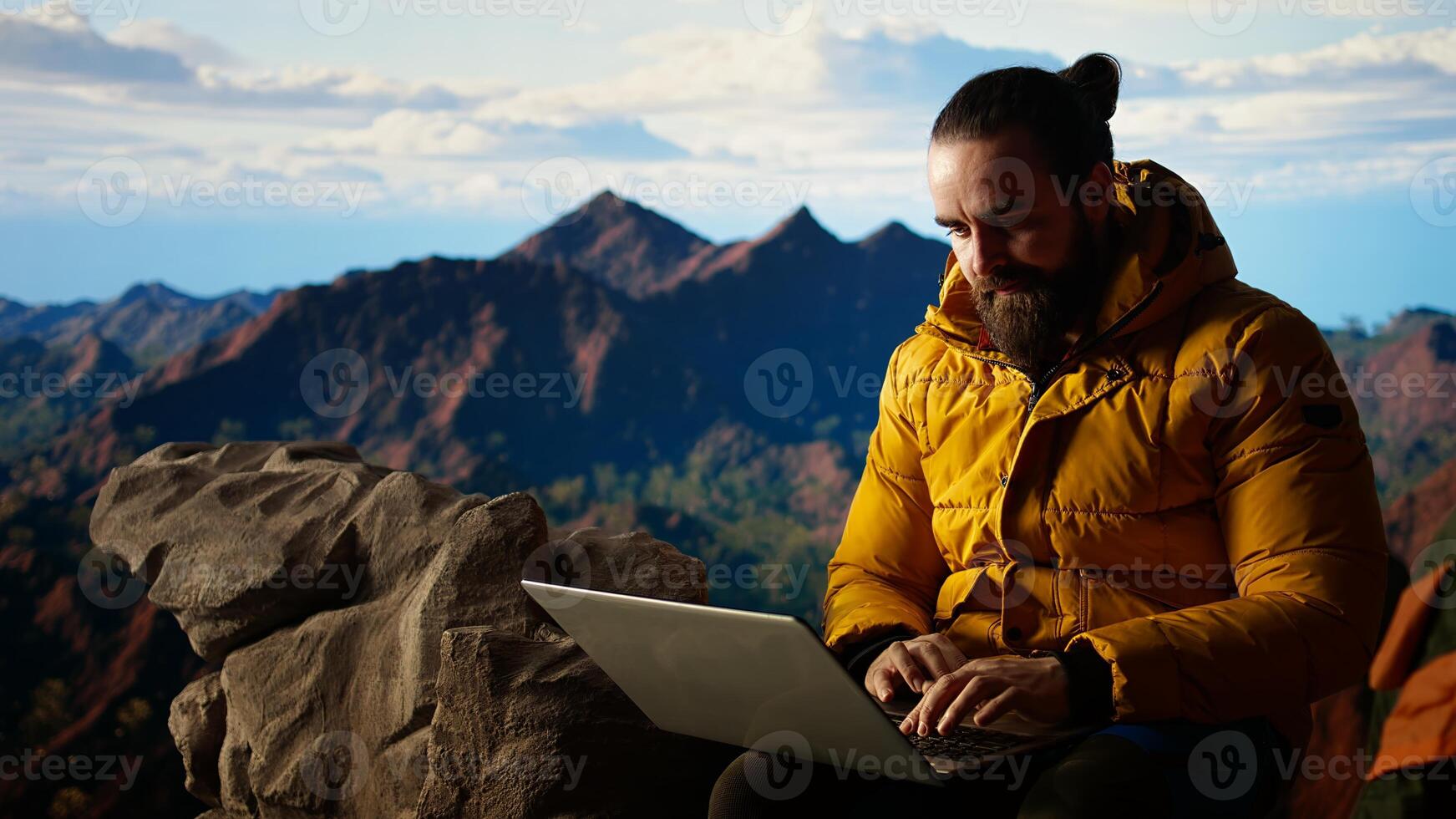 Frustrated upset entrepreneur getting tired of work problems on vacation, strong signal and internet everywhere for a person climbing on mountain top. Hiker trying to decompress. Camera A. photo