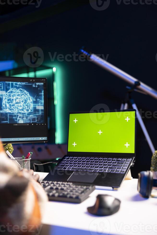 African american web developer using isolated mockup on pc and writing code, working with programming language on terminal window. Black person working from home, monitoring software system. photo