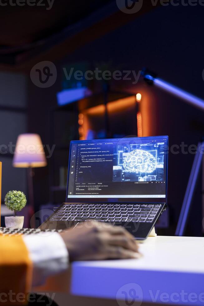 AI expert writes code on laptop in apartment office using Java programming languages. Artificial intelligence programmer remotely working on fixing database errors while working from home, close up photo