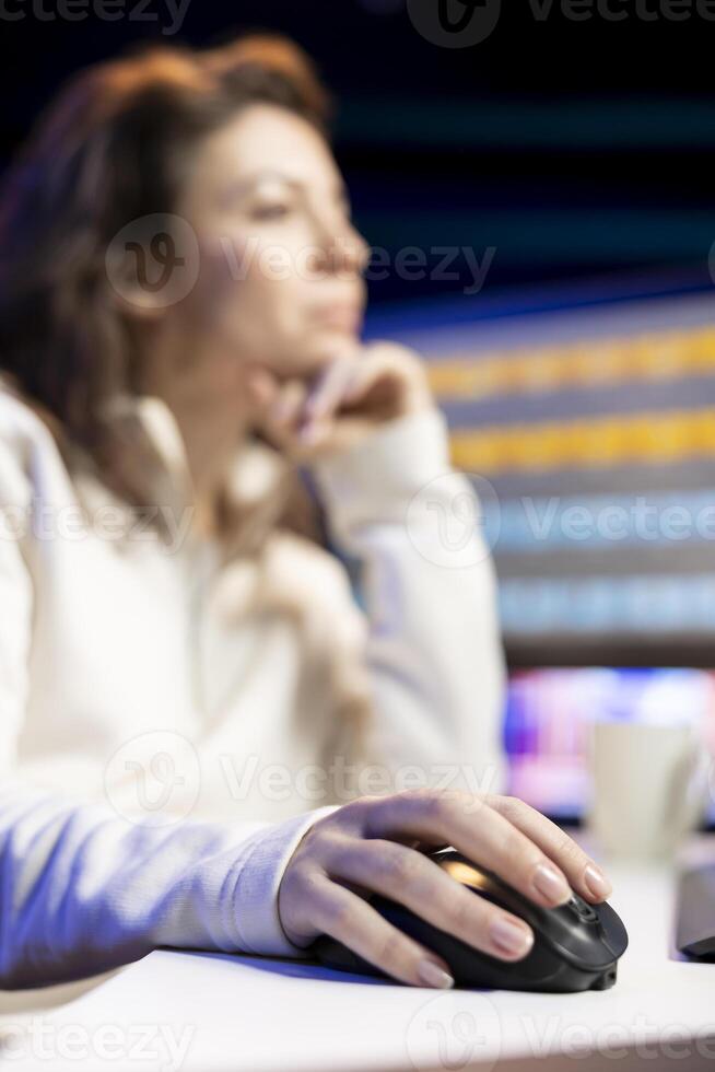 Content specialist working in graphic design media company, selecting best editorial pictures for social media post, focus on mouse. Expert editing photos in advertising agency office, close up shot