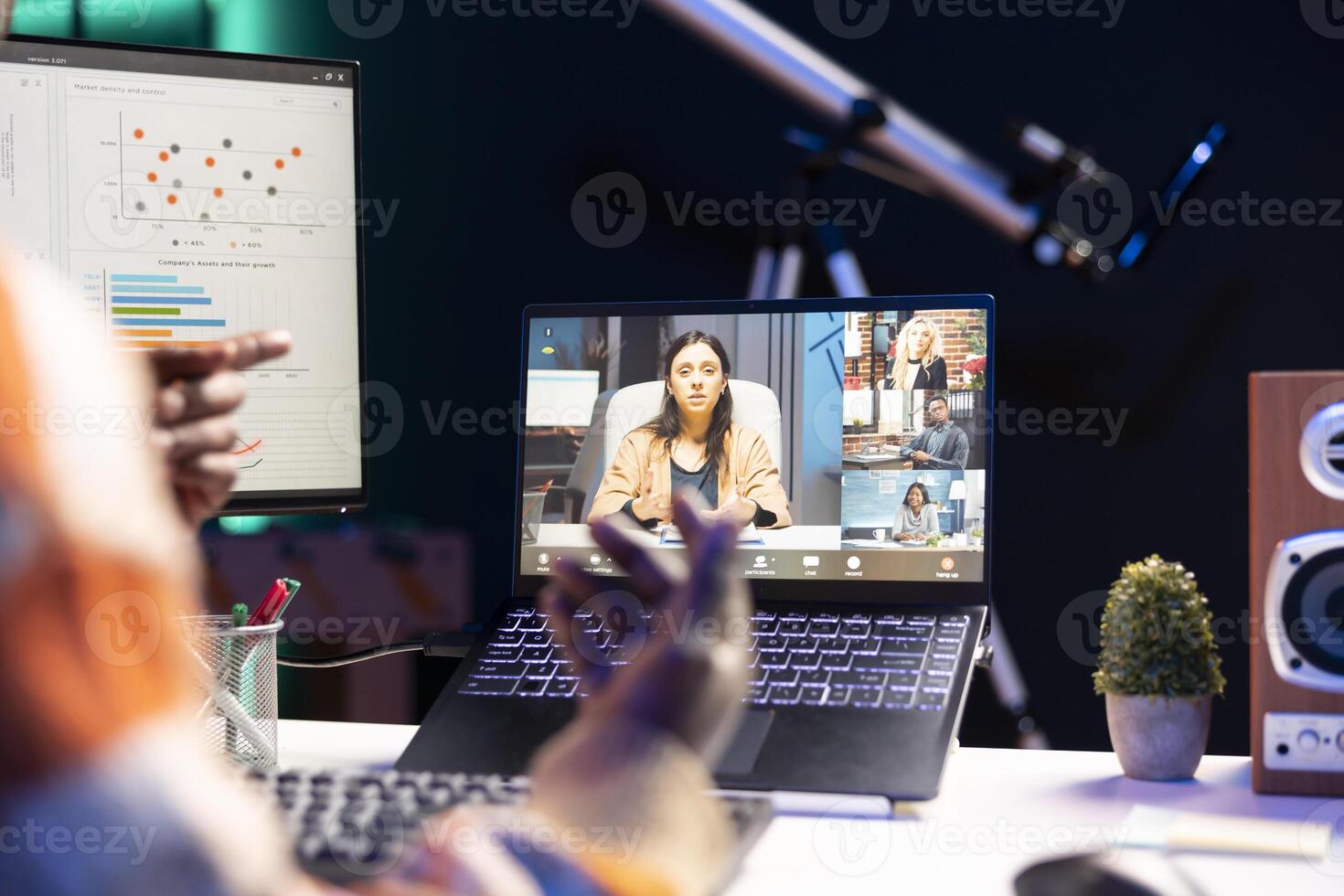 African american man employee having a call with colleagues while working from home office. Coworkers engaged in a discussion utilizing technology for virtual communication. photo