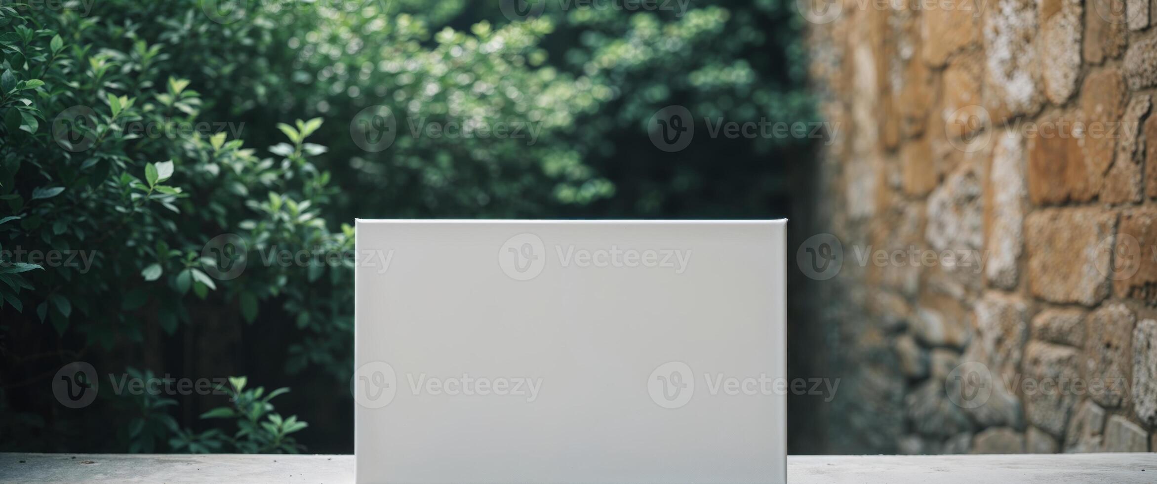 Blank white box mockup on stone wall photo
