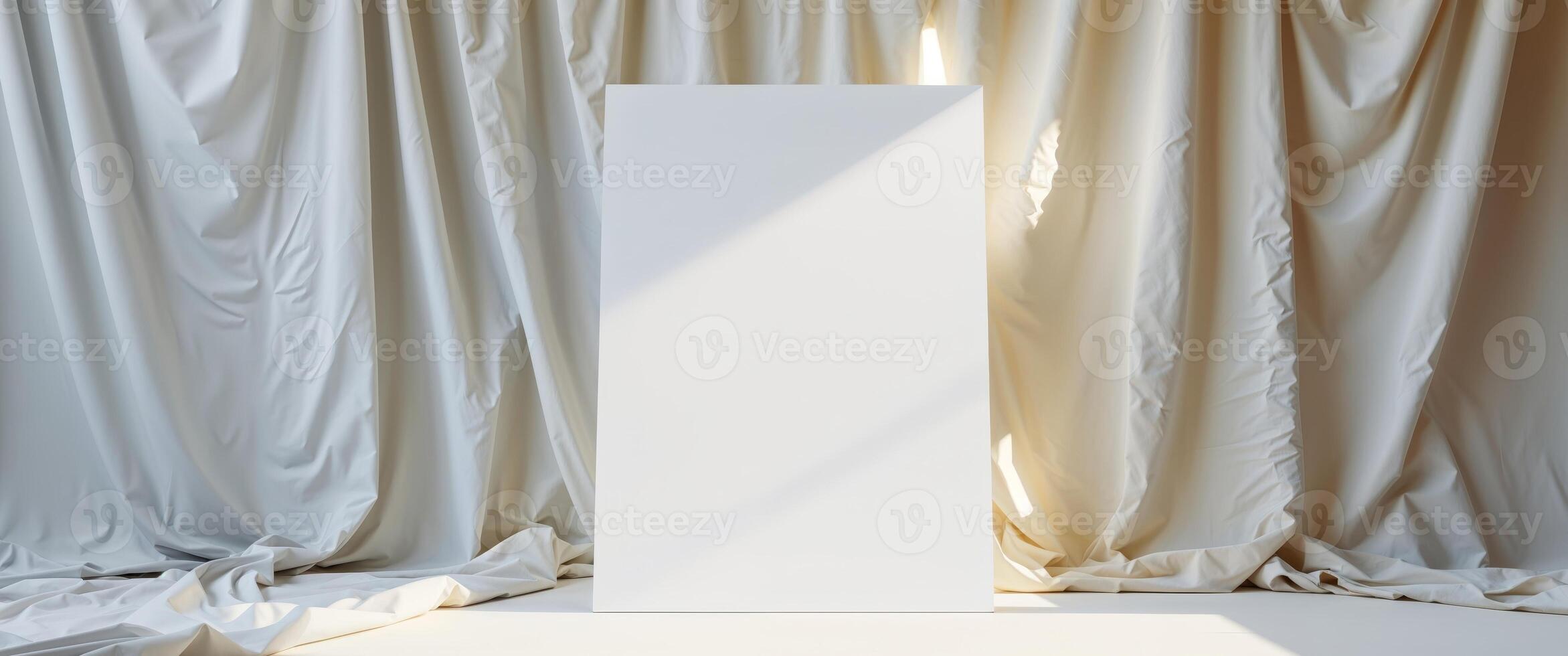 An empty white square in front of a curtain photo