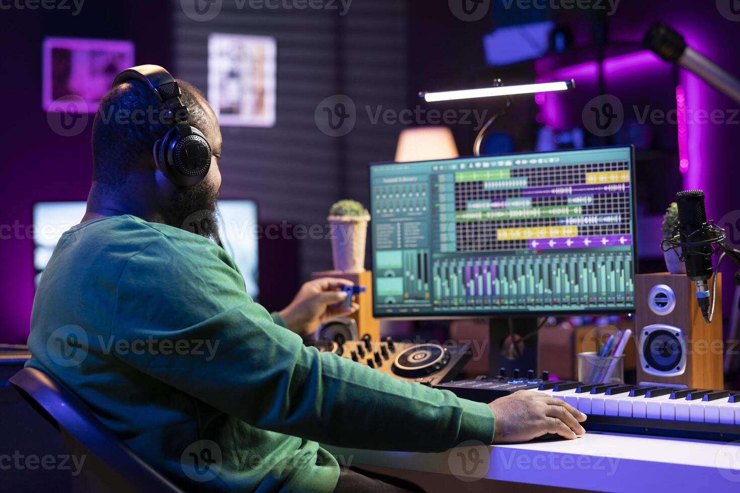 Musical engineer producing new tracks with an usb stick in home studio, editing songs from old audio files. Young sound designer mixing and mastering his recordings, professional software. photo