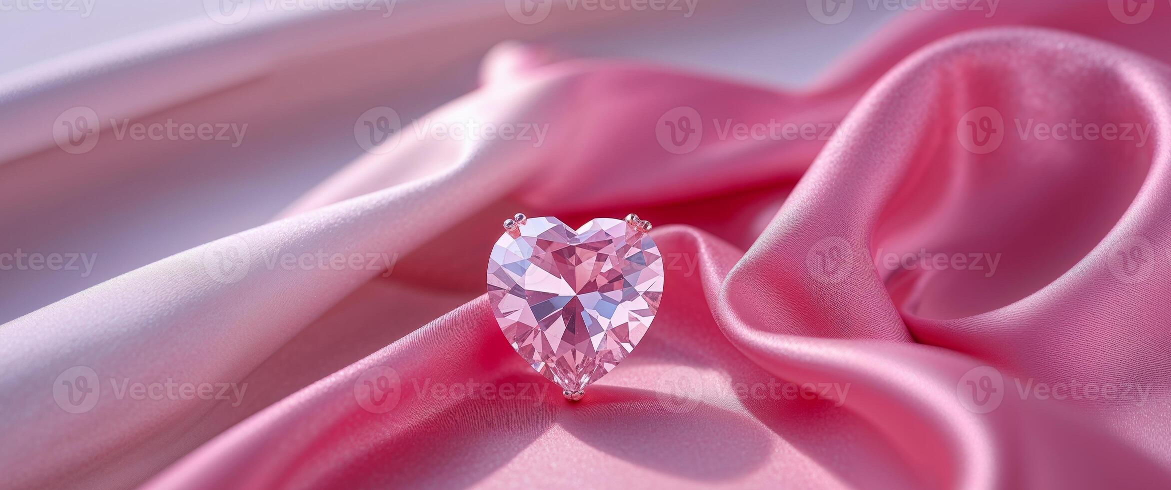 Stunning heart gemstone earrings placed on a gradient pink silk cloth photo