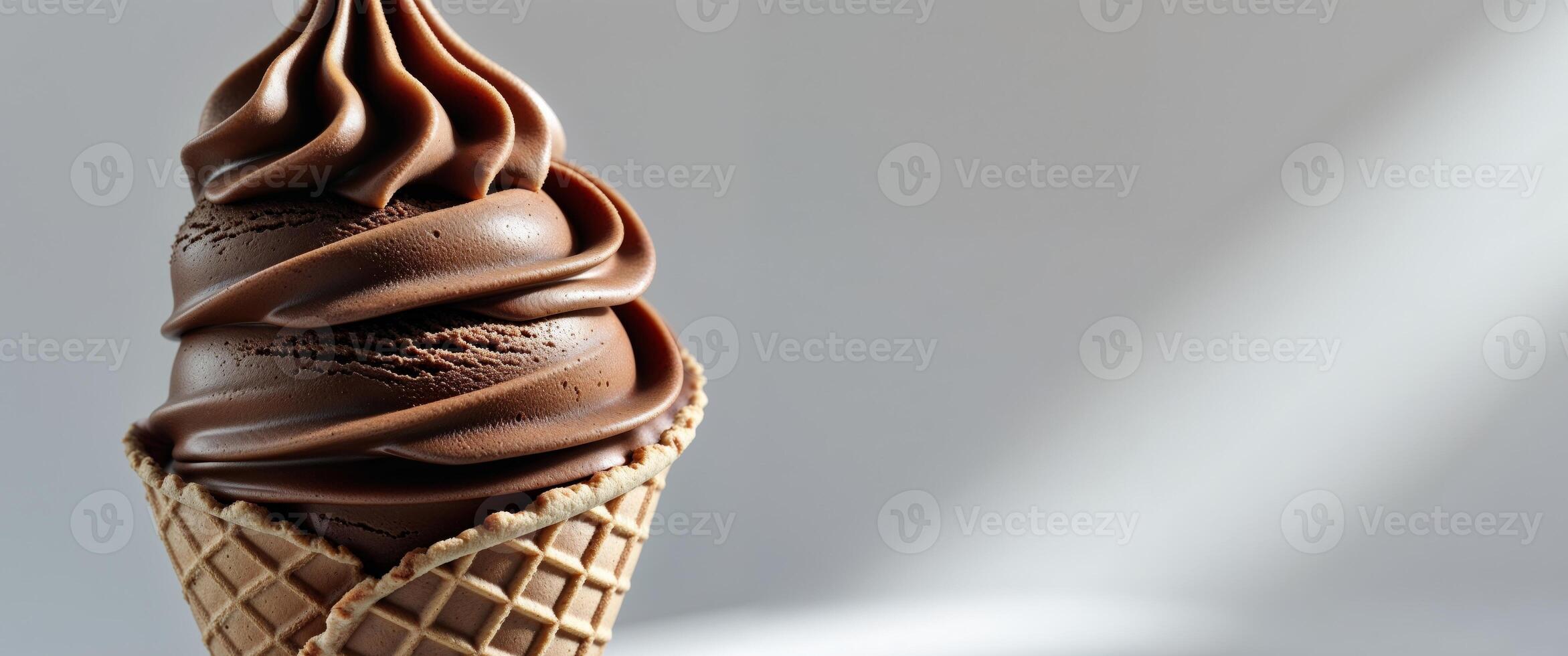 Decadent chocolate ice cream cone with a rich creamy texture photo