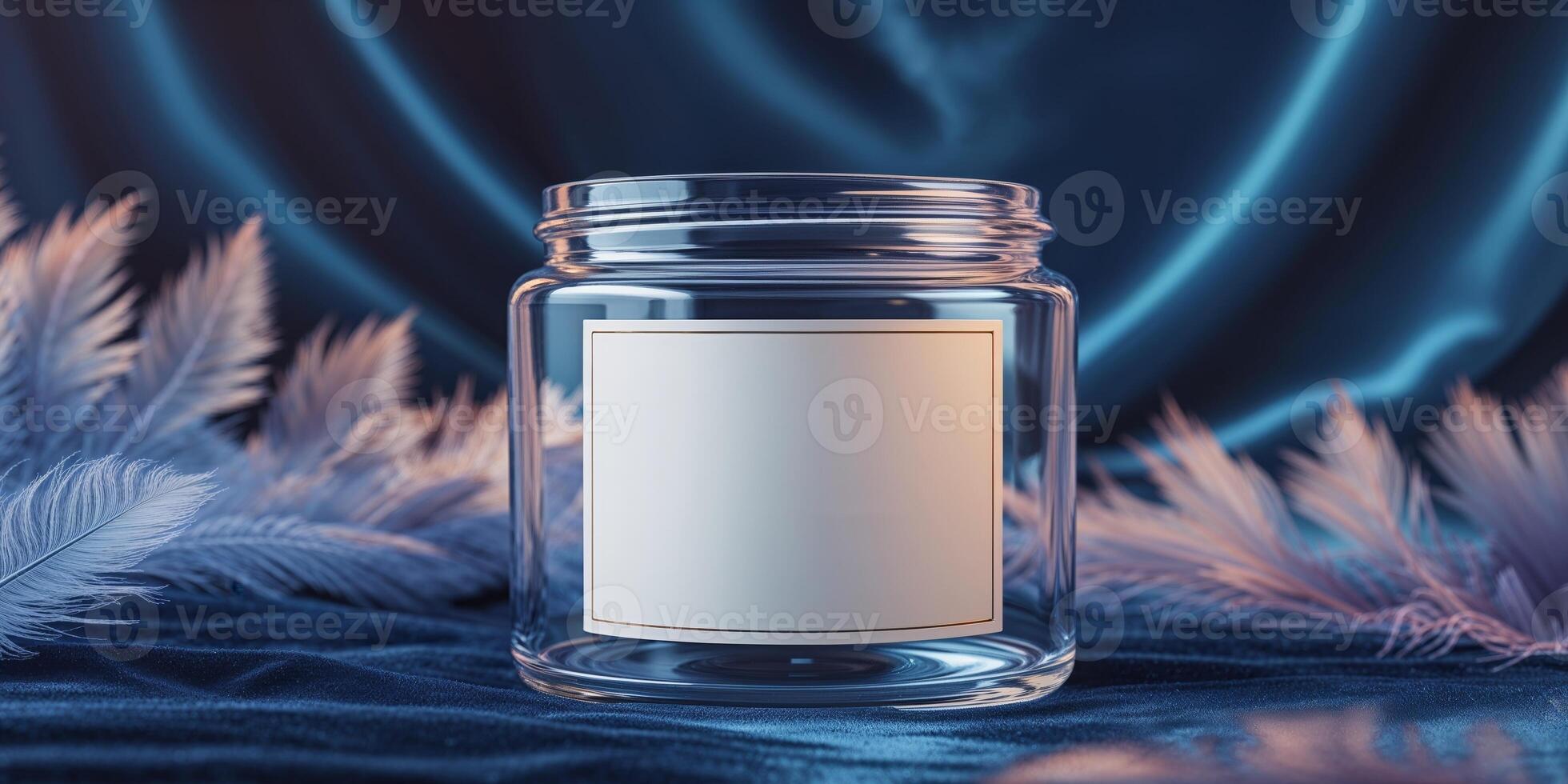 A glass jar with a blank label on top of a blue fabric photo