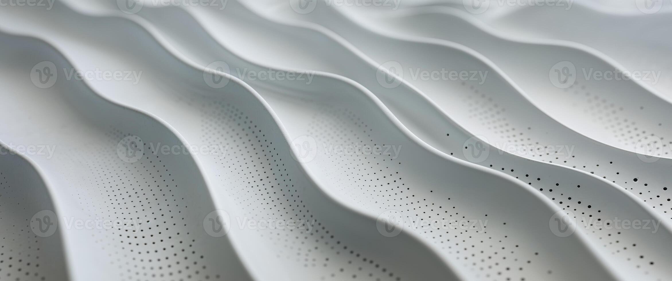 Subtle gray undulating surface with evenly distributed perforations photo