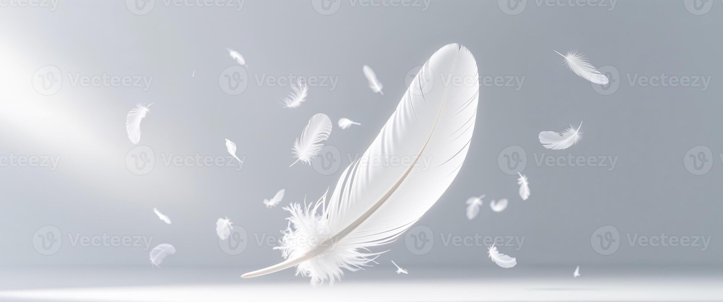 A luminous white feather surrounded by multiple smaller floating feathers. photo