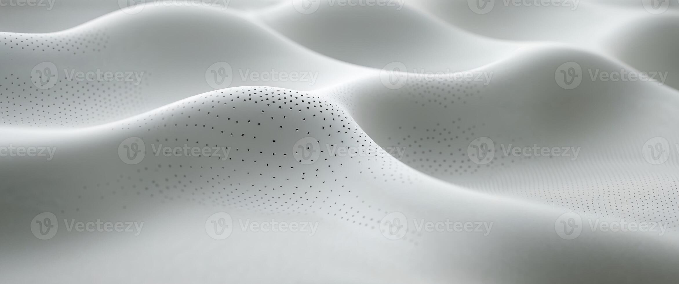 Subtle gray undulating surface with evenly distributed perforations. photo
