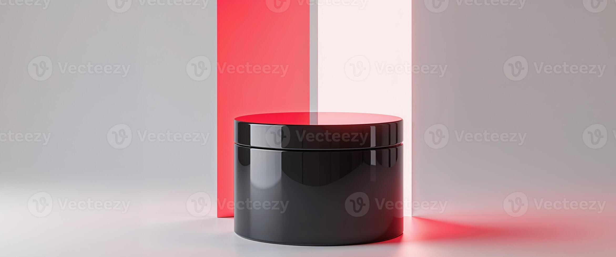 A black and red trash can sitting on a white surface photo