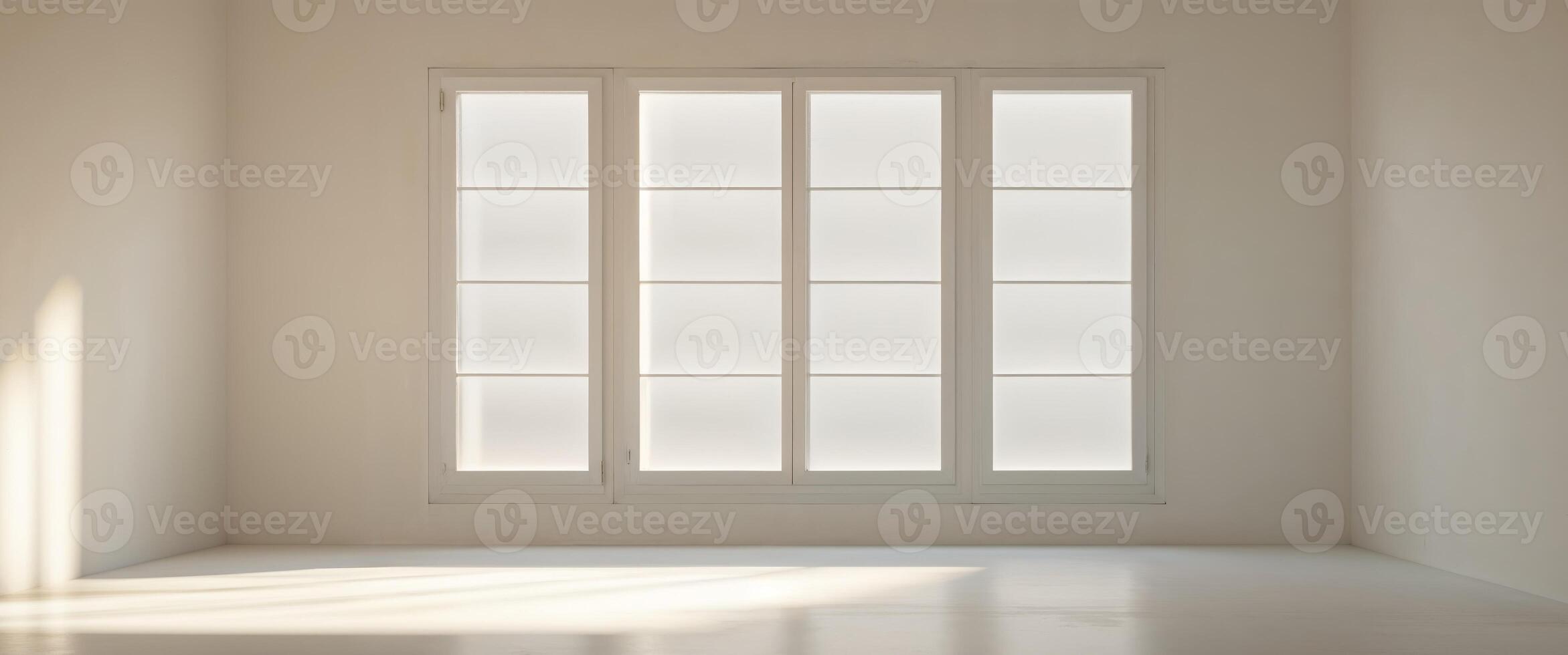 A room with a large window that is letting in a lot of sunlight. photo