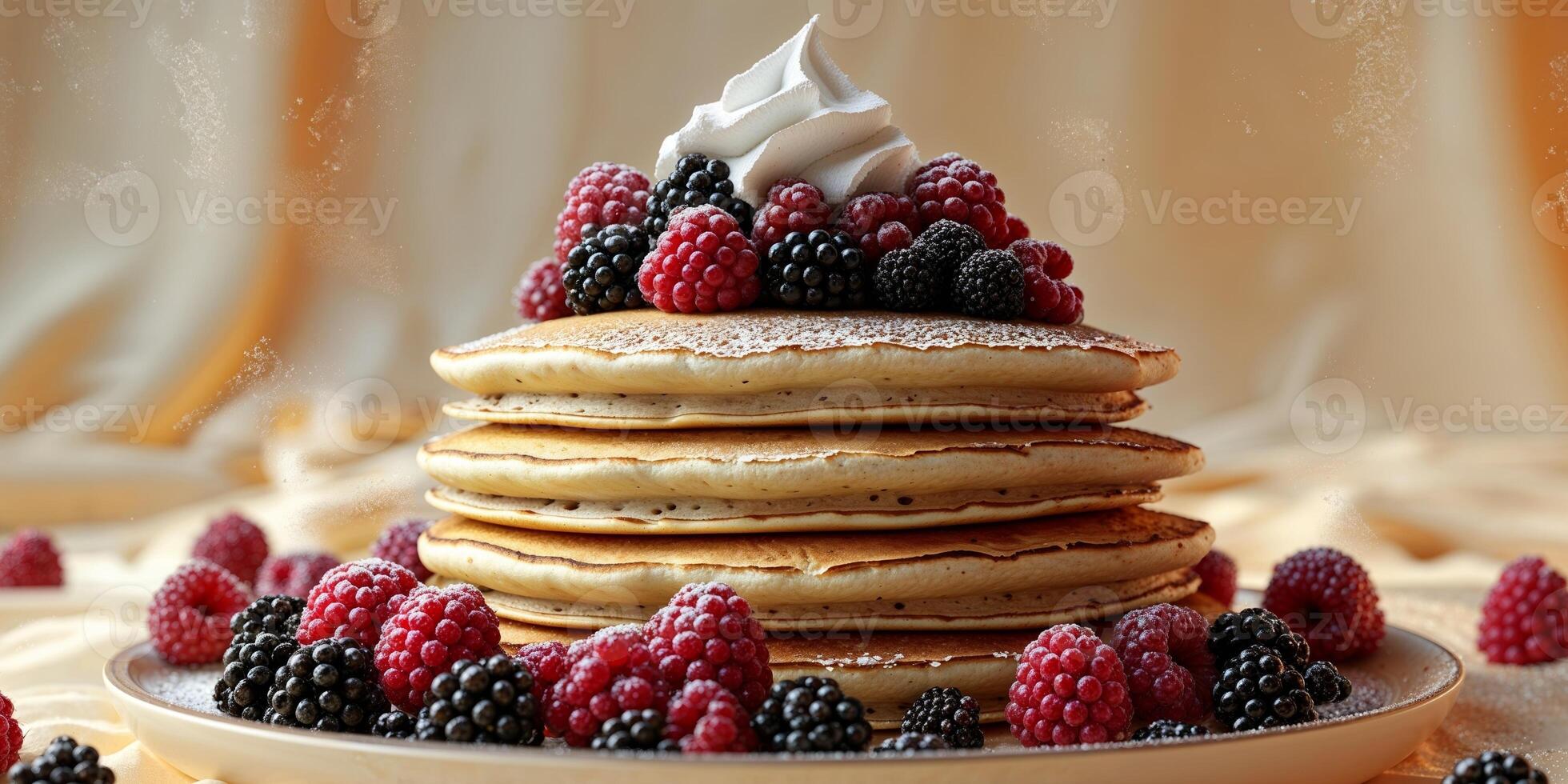 A stack of pancakes with berries and whipped cream photo