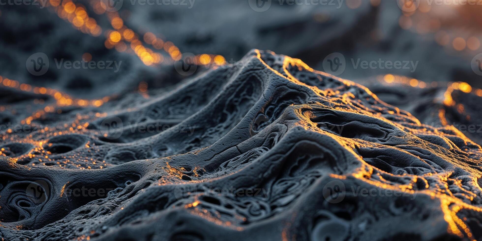 Intricate surface texture of porous black lava rock with unique formations. photo
